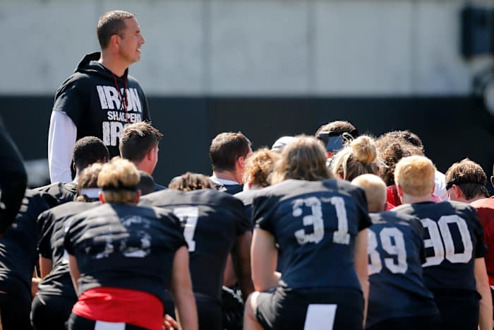 Luke Fickell speaking with his Cincinnati team during fall camp.